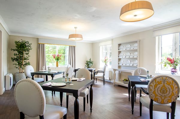 Bright dining area with tables and chairs
