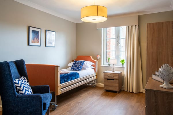 Bright private room with bed and seating area