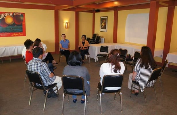 Residents and staff in a group activity session