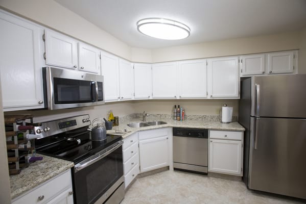 Bright kitchen area with modern appliances