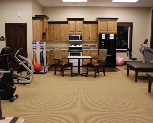 Interior view of a fitness area with equipment and seating