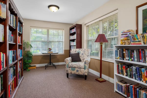 Cozy reading nook with bookshelves and an armchair