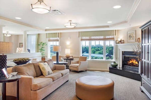 A cozy living room with comfortable seating and a fireplace.