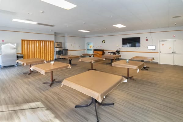 Dining room area with empty tables and chairs