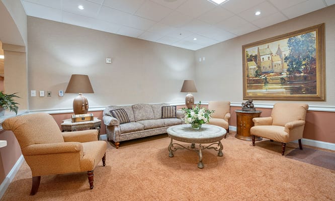 Cozy lounge with sofas and chairs in a senior living facility