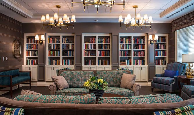 Cozy lounge with seating and bookshelves