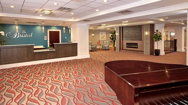 Interior view of The Bristal Assisted Living lobby with reception desk