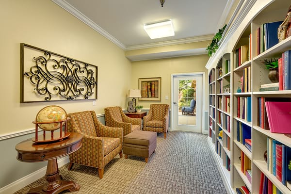 Cozy living room with bookshelves and seating area