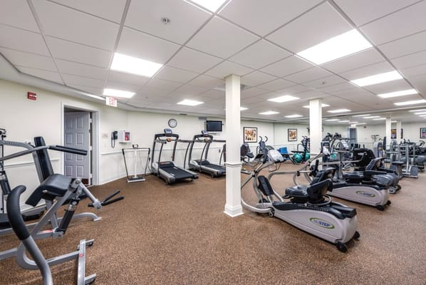 Gym with various exercise equipment and treadmills