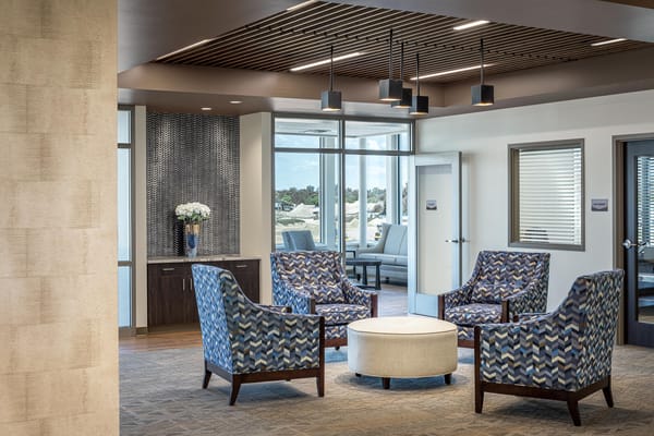 Comfortable lounge area with patterned chairs and a round table