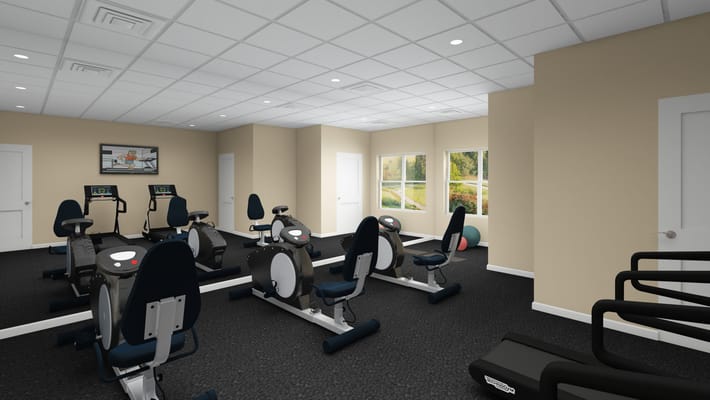 Modern gym with exercise bikes and large windows