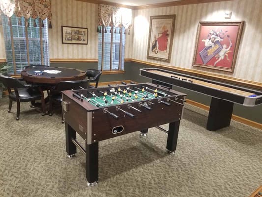 Activity room with foosball and shuffleboard tables