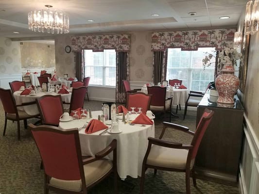 Bright dining room with elegantly set tables