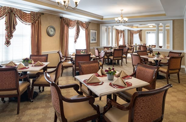 Elegant dining room set up with tables and chairs