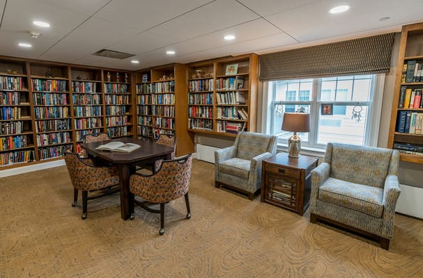Interior view of a library with bookshelves and seating