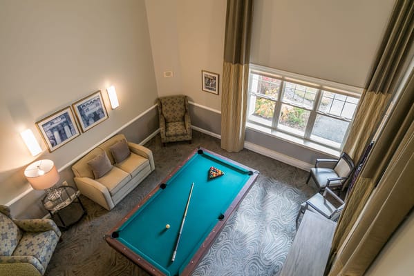 Interior shooting pool in a cozy common area