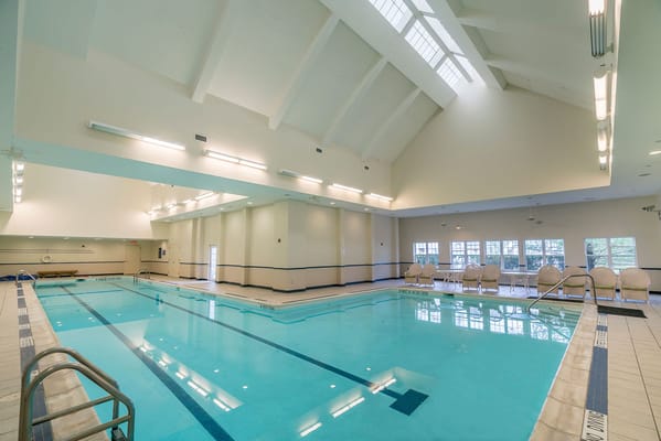Indoor swimming pool area with ample natural light