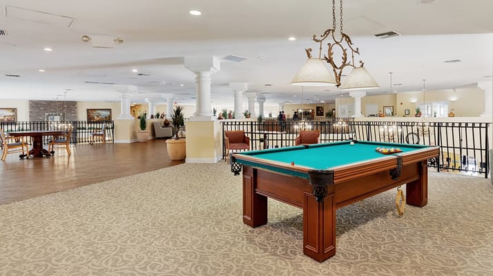 Interior common area with a pool table and seating