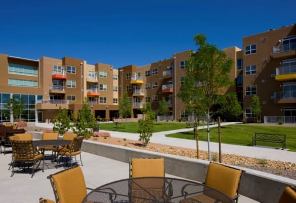 Outdoor courtyard with seating and landscaped area at The Neighborhood in Rio Rancho.