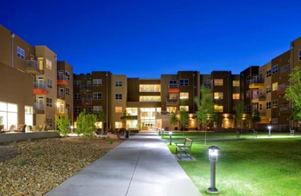 A well-lit pathway leading to the exterior of The Neighborhood in Rio Rancho Life Plan Community.