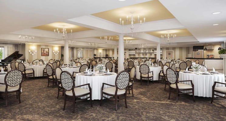 Dining area with round tables and decorative chairs