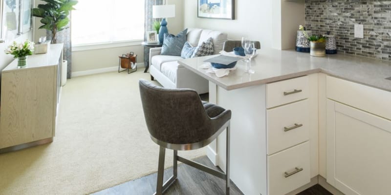 Bright and airy living room with a kitchen bar