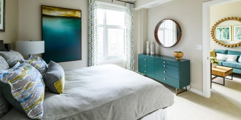 Stylish bedroom with large window and modern decor