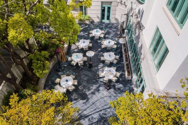 Aerial view of the outdoor patio with tables and umbrellas at The Stratford.