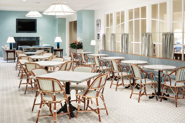 Bright and inviting dining area with tables and chairs