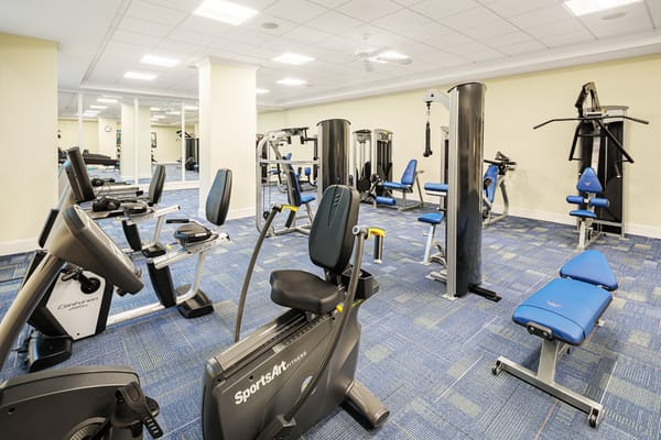 Modern gym with exercise equipment in a senior living community