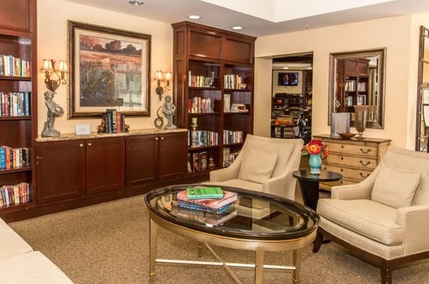 Inviting living room with bookshelves and comfortable seating
