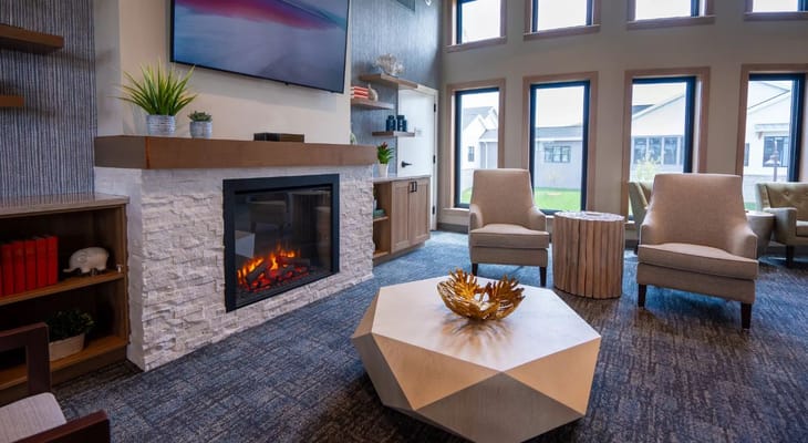 Cozy common area with a fireplace and seating