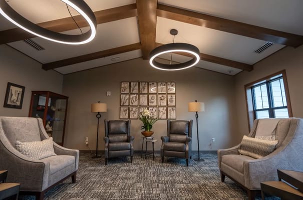 Cozy lounge area with comfortable seating and modern lighting