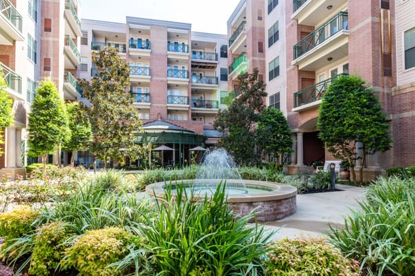 Courtyard with fountain and greenery in a senior living facility
