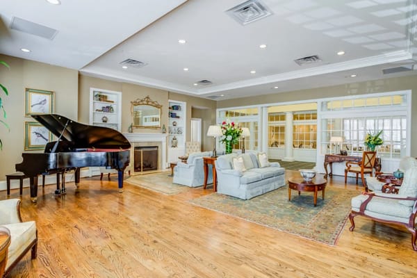 Interior view of a cozy common area with a piano