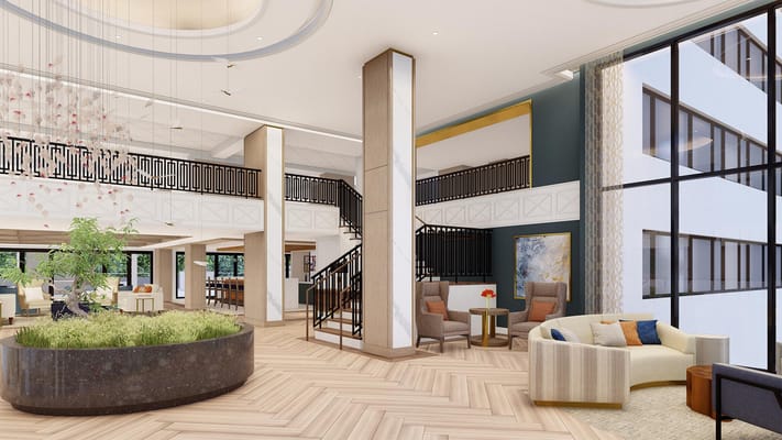 Interior view of The Virginian lobby featuring seating areas and large windows.