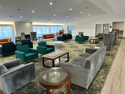 Bright common area with comfortable seating and natural light