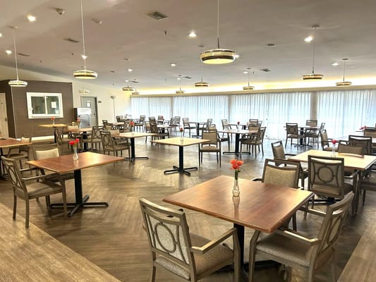 Dining area with tables and chairs, no occupants