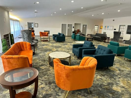 Bright lounge area with colorful seating and open space