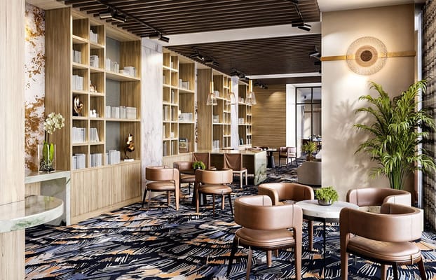 Stylish lobby area with comfortable seating and bookshelves