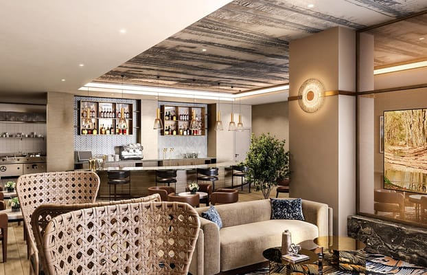 Elegant lounge featuring a bar and cozy seating in The Watermark at Bellevue.