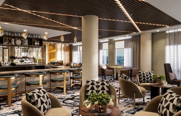 Luxurious lounge with modern seating and bar area