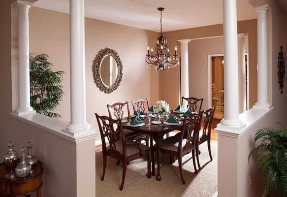 Elegant dining room setup with table and chairs