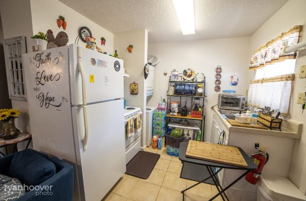 Bright kitchen area with various appliances and decor