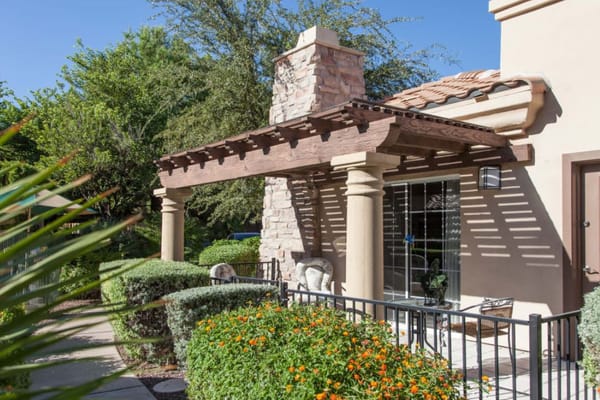 Exterior view of a facility with landscaping and seating area