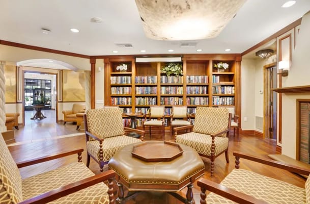Interior view of a cozy library area with seating