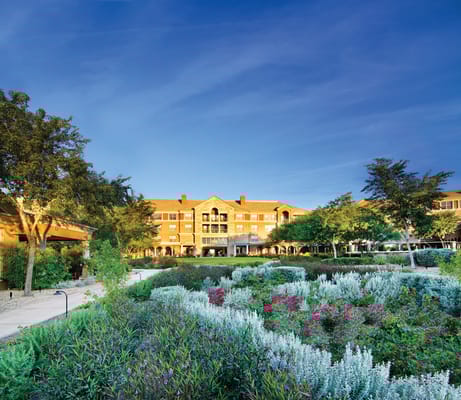 Lush garden with blooming flowers in front of Vi at Silverstone