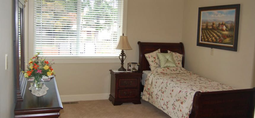 Cozy private resident room with a bed and window