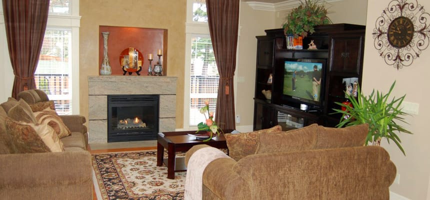 Cozy common area with seating and a fireplace