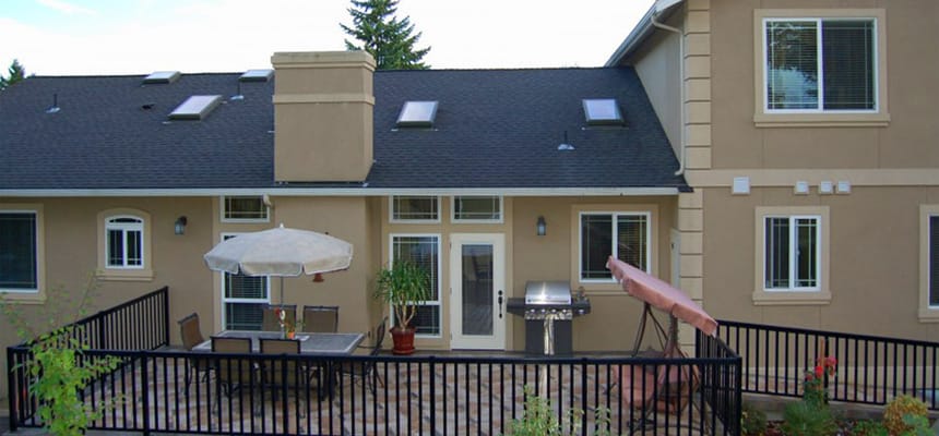 Outdoor patio area with seating and grill